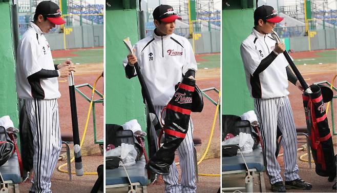 2011.05.19 '염경엽 코치의 정성' LG 염경엽 코치가 경기 전 좋은 타격을 위해 방망이 집을 선수들 배트 가방에 넣어주고 있다.골프채 처럼 나무 방망이의 탄력을 보호하기 위해 방망이 집으로 싸 배트가방에 넣는다. IS 포토