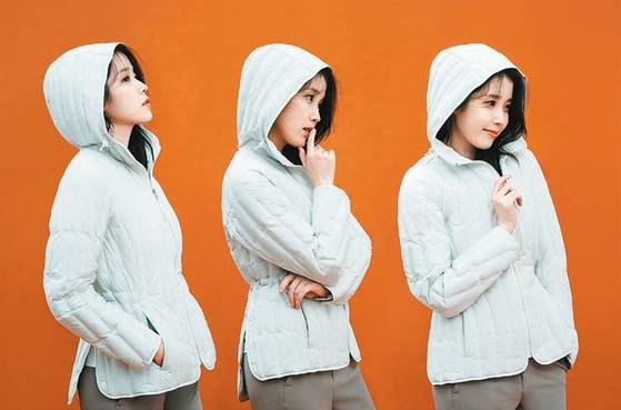 IU wears a quilted lightweight puffer for Black Yak's campaign shoot. [LF]