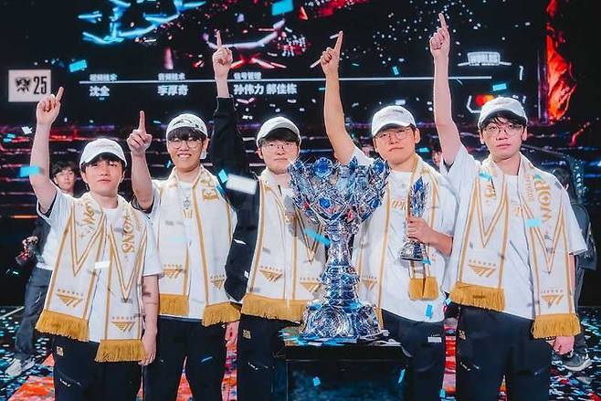 T1 members pose for a photo after their triumph at the 2025 LoL World Championship in Chengdu, China. (Riot Games)
