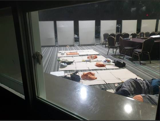 Police offers deployed to the 2025 Asia-Pacific Economic Cooperation (APEC) summit in Gyeongju, North Gyeongsang, sleep on the floor in this undated photo released by the Korean National Police Workers Council. [KOREAN NATIONAL POLICE WORKERS COUNCIL]