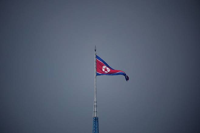 A North Korean flag flutters at the propaganda village of Gijungdong in North Korea on July 19, 2022. [REUTERS/YONHAP]