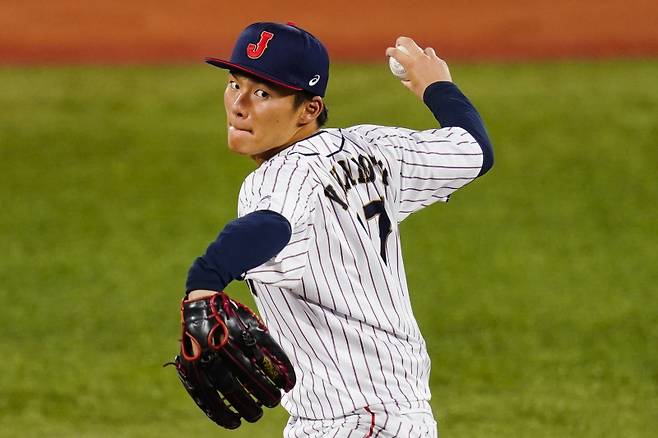 Japan's Yoshinobu Yamamoto pitches during the during a semi-final baseball game against South Korea at the 2020 Summer Olympics, Wednesday, Aug. 4, 2021, in Yokohama, Japan. (AP Photo/Matt Slocum)