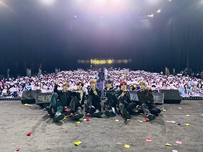Close Your Eyes poses for a photo at its fan meeting held in Hangzhou, China, on Dec. 6 (X, @closeyoureyes_7)