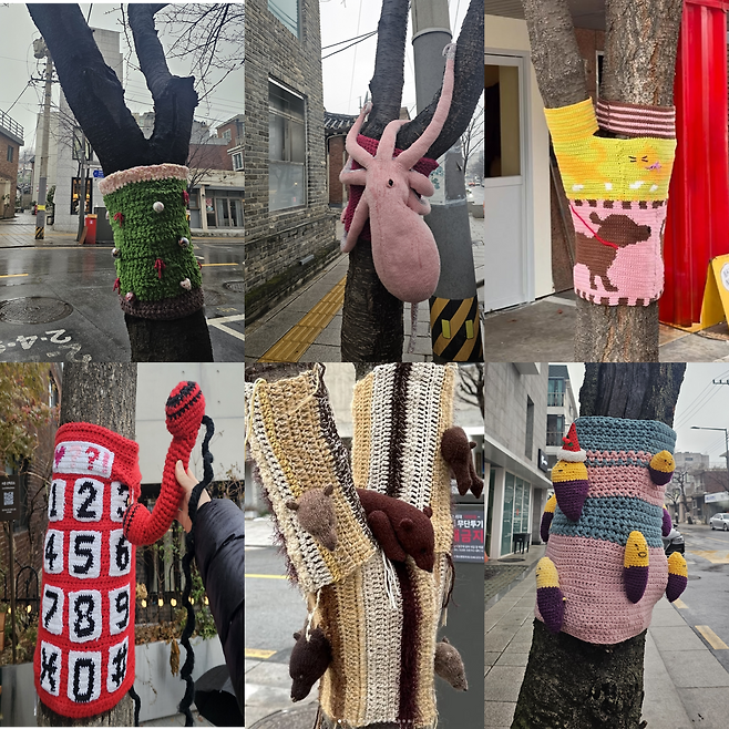 Roadside trees in Jongno gu, Seoul, are adorned with knit installations featuring various designs, including a telephone, a Christmas tree, an octopus doll, bears and sweet potatoes. (Choi Jae hee/The Korea Herald)