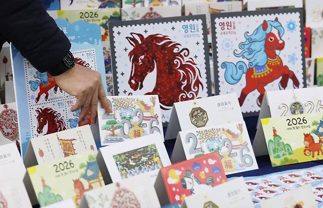 Stamps and cards illustrated with horses, symbolizing next year's the Year of the Horse, are on display at the Seoul Central Post Office in central Seoul on Nov. 27, 2025. [NEWS1]