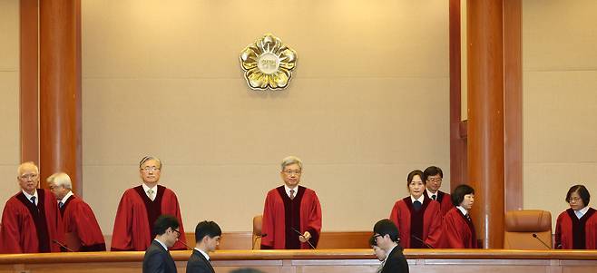 Presiding justices of the Constitutional Court take their seats during a court session on Dec. 1, 2025. [NEWS1]