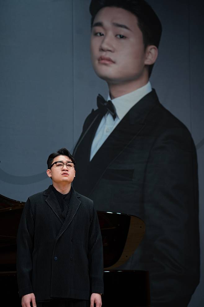 Baritone Kim Taehan, Kumho Art Hall's Artist-in-Resdience for 2026, sings during a press conference held at the Kumho Art Hall on Tuesday. (Kumho Art Hall)