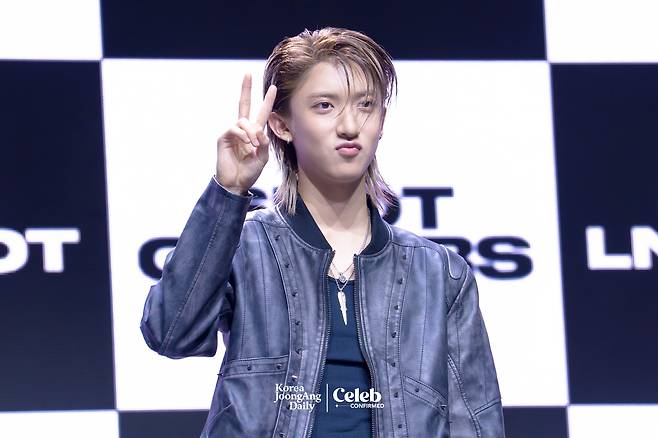 LNGSHOT’s Woojin poses for photos during a showcase for the release of the group’s first EP, ″Shot Callers,″ at Myunghwa Live Hall in western Seoul on Jan. 13. [DANIELA GONZALEZ PEREZ]