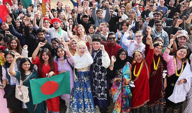In this unrelated photo, international students at Ajou University attend an event wearing their countries' traditional attire in November 2025. (Yonhap)