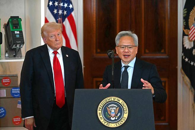 Nvidia CEO Jensen Huang, right, speaks alongside U.S. President Donald Trump about investing in America at the White House in Washington on April 30, 2025. [AFP/YONHAP]