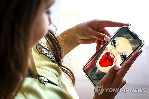 소셜미디어를 이용하는 호주 어린이 [AFP 연합뉴스 자료사진. 재판매 및 DB 금지]