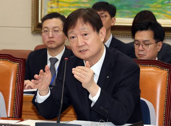Lee Chan-jin, chief of the Financial Supervisory Service, answers questions from lawmakers during a parliamentary hearing held at the National Assembly in western Seoul on Feb. 11, 2026. [YONHAP]
