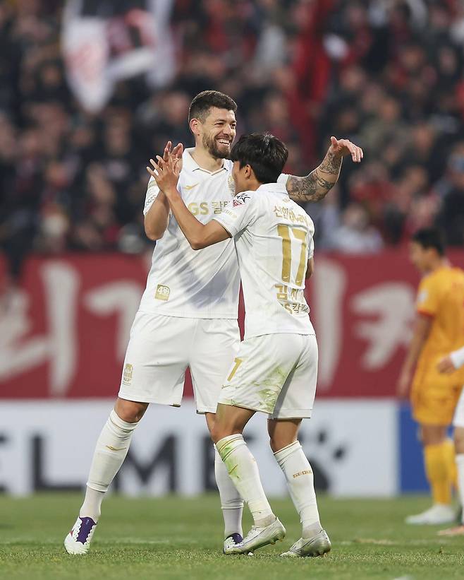 FC Seoul's Osmar, left, celebrates with Kim Jin-ya after scoring a goal against Gwangju FC at Gwangju Football Stadium in Gwangju in a photo shared on FC Seoul's official Facebook page in March 2023. [SCREEN CAPTURE]