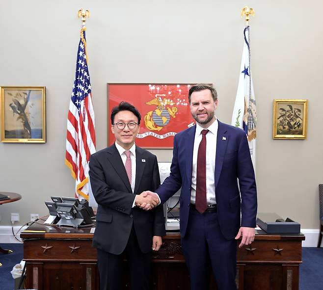 South Korea's Prime Minister Kim Min-seok, left, shakes hands with U.S. Vice President JD Vance as they meet for talks at the White House in Washington on March 12 in this photo released by Kim's office. [YONHAP]