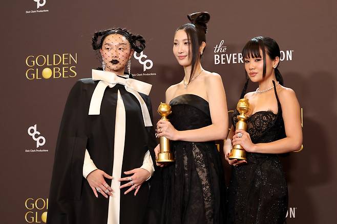 Audrey Nuna (left), Ejae (center) and Rei Ami pose with their award for best original song in a motion picture for "Golden" from "KPop Demon Hunters" at the 83rd Golden Globe Awards in Beverly Hills, California, on Jan 11. (Getty Images)