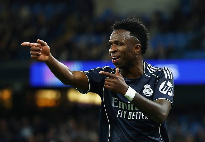 Soccer Football - UEFA Champions League - Round 16 - Second Leg - Manchester City v Real Madrid - Etihad Stadium, Manchester, Britain - March 17, 2026 Real Madrid's Vinicius Junior celebrates scoring their second goal Action Images via Reuters/Lee Smith







<저작권자(c) 연합뉴스, 무단 전재-재배포, AI 학습 및 활용 금지>
