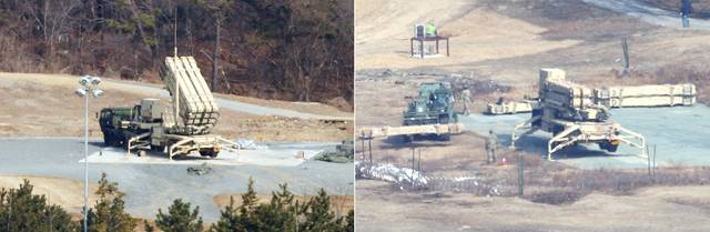 지난 5일 경북 성주군의 미군 사드 기지에서 방공무기 발사대 해체 작업(사진 오른쪽)이 진행되고 있다. 같은 시각 다른 발사대(사진 왼쪽)는 준비 태세를 갖춘 모습이다. 연합뉴스