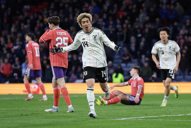 Soccer Football - International Friendly - Scotland v Japan - Hampden Park, Glasgow, Scotland, Britain - March 28, 2026 Japan's Junya Ito celebrates scoring their first goal REUTERS/Russell Cheyne     TPX IMAGES OF THE DAY







<저작권자(c) 연합뉴스, 무단 전재-재배포, AI 학습 및 활용 금지>