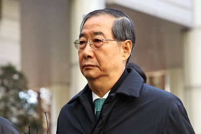 12·3 비상계엄 관련 내란 방조 등 혐의를 받는 한덕수 전 국무총리가 21일 서울 서초구 서울중앙지법에서 열린 1심 선고공판에 출석하고 있다. 2026.01.21. [서울=뉴시스]