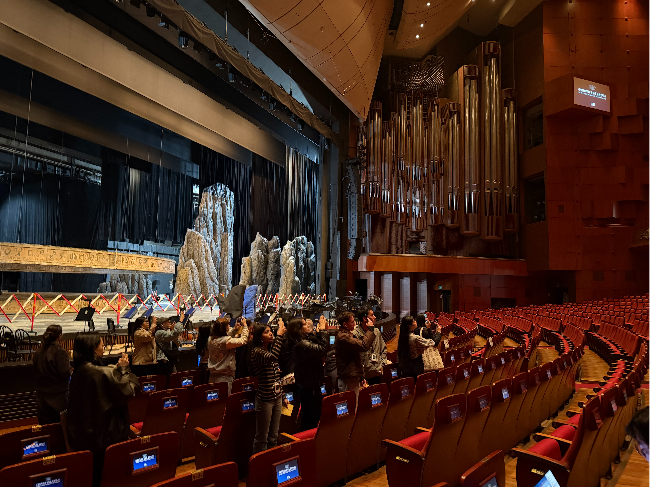 Participants attend Sejong Center's backstage tour program for international visitors on Thursday inside the Grand Theater of the Sejong Center for the Performing Arts in central Seoul. (Park Ga-young/The Korea Herald)