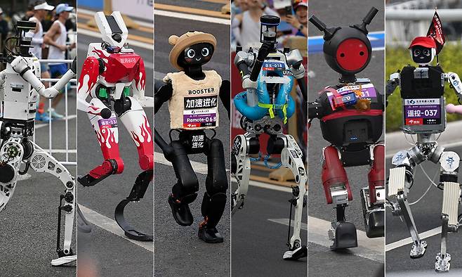 성큼성큼·아장아장·뒤뚱뒤뚱… 뛰는 모습 제각각 19일 중국 베이징 이좡의 퉁밍후 공원에서 열린 ‘제2회 베이징 이좡 휴머노이드 로봇 하프 마라톤’ 대회에서 다양한 로봇들이 마라톤 코스를 달리고 있다. 자율주행 42개 팀을 포함, 총 105개 팀이 참가해 한층 발전한 로봇 기술을 보여줬다. 가운데는 자율주행 그룹에서 50분26초의 기록으로 우승을 차지한 ‘치톈다성’ 팀의 로봇으로, 스마트폰 제조사 아너(HONOR)가 개발한 ‘산뎬’을 학습시켰다. 베이징=AFP·AP·로이터·EPA연합뉴스