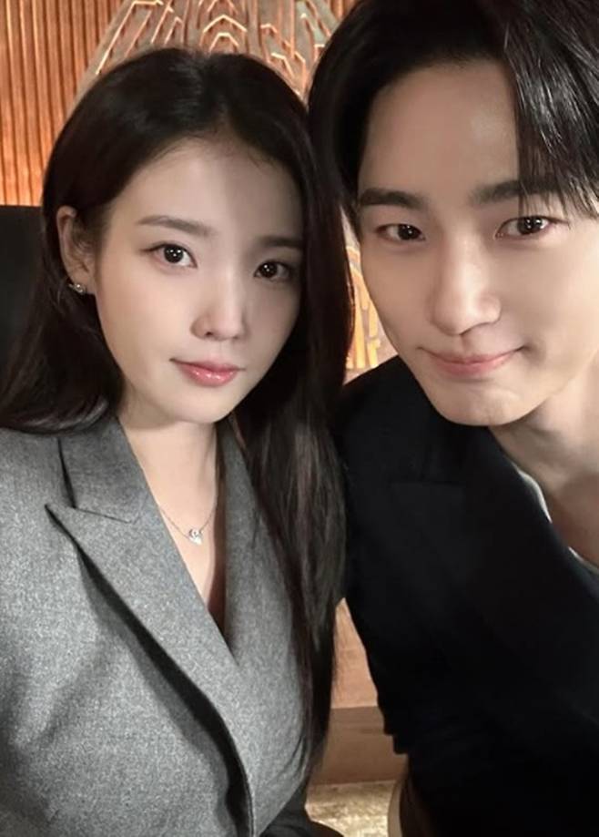 Singer and actress IU shared behind-the-scenes photos from Perfect Crown.On the 10th, IU posted a photo along with the caption, Behind-the-scenes of Episode 10. It was like this, but it turned out like this again.The released photo shows IU taking a sweet selfie with Byun Woo-suk, who is co-starring with her in the currently airing MBC Friday-Saturday drama Perfect Crown.The two, who play the roles of Sung Hee-joo and Grand Prince Lee An respectively in Perfect Crown, bring laughter to viewers by making broken hearts and pouting faces, only to soon lean closer and smile.Perfect Crown, which began airing on the 10th of last month, is set in 21st-century South Korea, a constitutional monarchy. It depicts the romance between Sung Hee-joo (played by IU), a woman who is annoyed by her status as a commoner despite having everything for a chaebol, and Grand Prince Lee An (played by Byun Woo-suk), a man saddened by his inability to possess anything despite being the son of a king. In the 10th episode aired on the 9th, Sung Hee-joo and Grand Prince Lee An confirmed their feelings for each other with a mutual kiss, leaving viewers curious about the future developments.Photo = IU