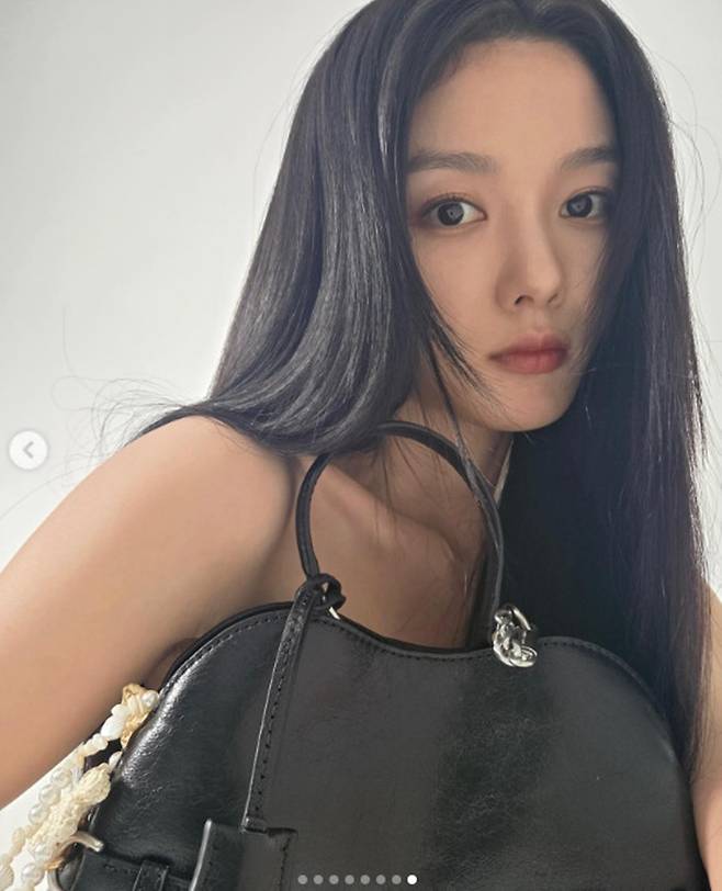 Actor Kim Yoo-jung shared updates on her personal account, showcasing her unchanging beauty and perfect figure even from unique camera angles. Wearing a denim mini dress, Kim Yoo-jung captivated viewers with various poses, including close-up selfies and shots taken from a top-down perspective.In the released photos, Kim Yoo-jung exuded an innocent vibe with her long, straight hair while adding a chic charm by matching it with a black bag. In particular, her distinct facial features and slender legs stood out, looking flawless from every angle.Fans reacted enthusiastically to Kim Yoo-jungs post, expressing their delight at her recent updates. Kim Yoo-jung is currently preparing to star in her next project, the film Revenge Ghost (working title).