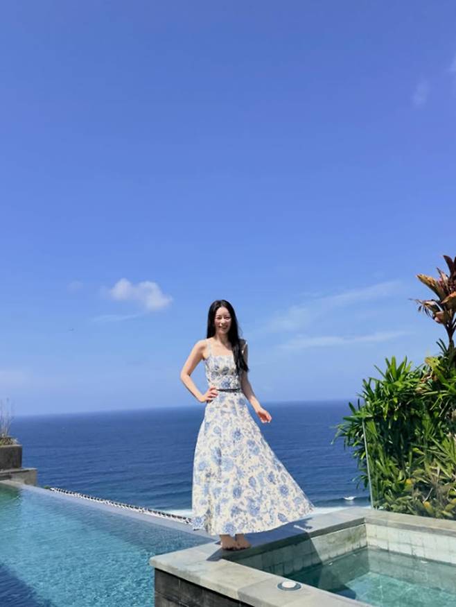 Actress Lim Ji-yeon has garnered attention by sharing recent photos from her trip to Bali on her social media. In the released photos, set against a resort backdrop, Lim Ji-yeon showcased various outfits, exuding an innocent vibe while displaying her slim figure in a bikini.Lim Ji-yeon perfectly pulled off white sleeveless tops and floral-patterned dresses, sharing photos of her daily life that looked like a photoshoot. In particular, photos taken at the swimming pool captivated fans by revealing her toned physique and shapely legs.Her long wavy hairstyle and natural smile added to her unrivaled charm. Currently, Lim Ji-yeon is continuing her active acting career by appearing in the SBS drama *Brave New World*.
