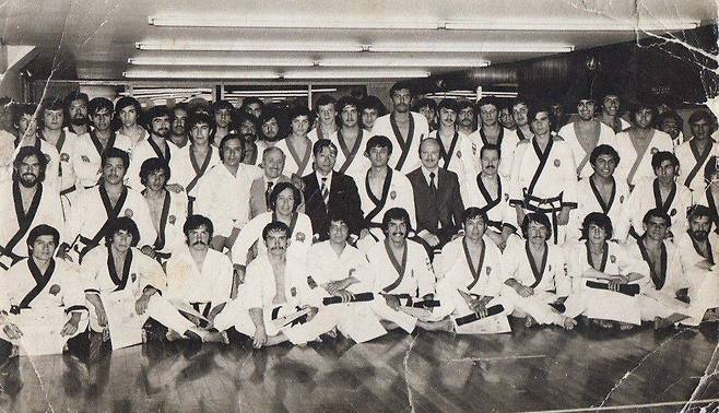 Moon (center) with students and associates at a dojang in an undated group photo believed to have been taken around 1975. (Moon Dai-won)