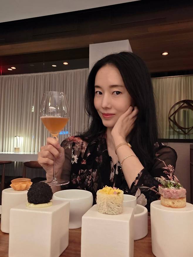 Singer and actress Lee Jung-hyun visited a Michelin three-star Korean restaurant in New York.On the 10th, Lee Jung-hyun posted several photos on her social media account along with the caption: A Korean restaurant with three Michelin stars in New York? I was so curious that I managed to secure a reservation after a lot of effort and went to check it out, along with several photos.In the photos, Lee Jung-hyun is posing with a glass of wine in front of a table of elegant-looking dishes. She shared that the food was excellent, writing, Foreign diners are marveling at the meal.The chef at the Michelin-starred restaurant recognized Lee Jung-hyun and prepared a special gift: he included Lee Jung-hyuns character on the menu. In response, Lee Jung-hyun expressed her gratitude, saying, The chef recognized me. Suddenly, my character appeared on the menu. Im so touched.The character of Lee Jung-hyun, drawn at the bottom of the menu, is striking his signature dance pose. The sight of world-class Lee Jung-hyun, recognized even in New York, drew gasps of amazement.Lee Jung-hyun also raved about the restaurant, saying, It was so delicious I almost fainted. I could never replicate this. I want to go back again.Meanwhile, Lee Jung-hyun married an orthopedic surgeon three years her junior in April 2019.Photo = Lee Jung-hyuns account