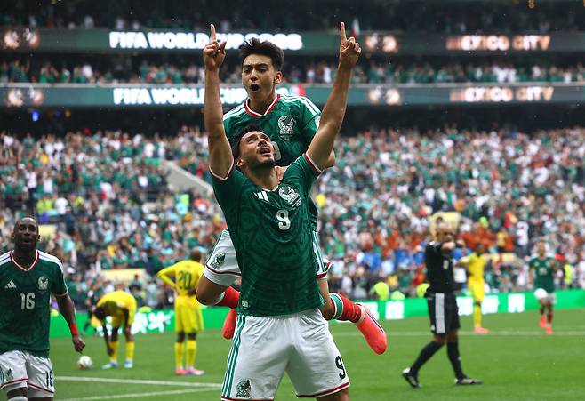 Mexican footballers celebrates after scoring their second goal at the FIFA World Cup 2026 held in Mexico on June 11. REUTERS/YONHAP