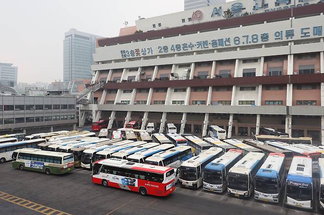 Express and intercity buses are parked outside the Express Bus Terminal in Seocho District, southern Seoul, on Feb. 13. YONHAP