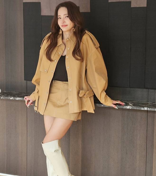 Actress Han Chae-young showcased her youthful looks once again by sharing a sophisticated leather outfit on her personal social media channel. Han Chae-young caught everyones attention with her flawless styling while sharing updates from her current filming project.In the released photos, Han Chae-young paired a black top with a beige jacket and miniskirt set, creating a calm and sophisticated look. She added white knee-high boots and gold accessories to complete the luxurious ensemble.With her long, wavy hair and a subtle smile, Han Chae-young revealed she was filming in Gangnam, exuding an air of elegance. Born in 1980, Han Chae-young continues to draw attention for her timeless beauty.