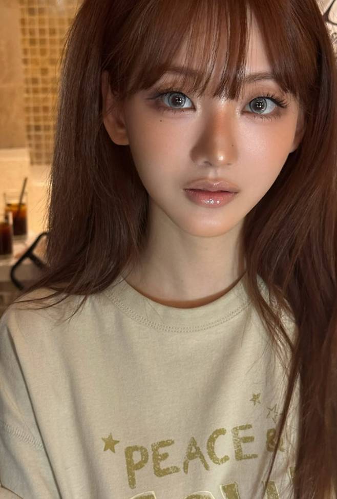 Actor Jo Yi-hyun showed off her doll-like beauty by posting recent photos on her social media, perfectly pulling off glamorous makeup. In the photos, Jo Yi-hyun exuded charm with her distinct features and a variety of expressions, including a wink toward the camera.Jo Yi-hyun highlighted her eyes with makeup emphasizing glamorous eyelashes and revealed her flawless visuals through close-up selfies. Fans reacted enthusiastically to Jo Yi-hyuns lovely appearance.Meanwhile, Jo Yi-hyun left a deep impression on the public by playing the role of Choi Nam-ra in the Netflix original drama *All of Us Are Dead*. Since then, she has been expanding her acting spectrum through consistent work.