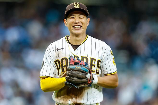 Jul 11, 2026; San Diego, California, USA; San Diego Padres third baseman Sung-Mun Song (24) smiles after making a diving catch during the fourth inning at Petco Park. Mandatory Credit: David Frerker-Imagn Images연합뉴스