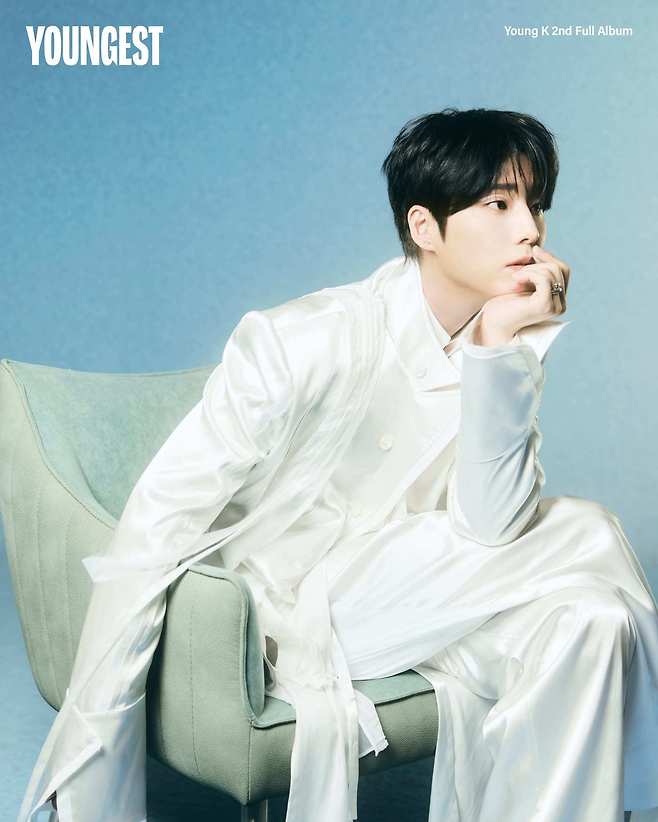 Young K, a member of the band DAY6, has unveiled four concept images with a dreamy atmosphere ahead of the release of their second full-length album, YOUNGEST. The new album is set to feature a total of 15 tracks, including the title track Shut The Door, with Young K contributing lyrics to every song.In the released photos, Young K exudes a mysterious and serene vibe against a blue background, dressed entirely in white. Through this album, Young K has captured his sincere reflections and musical passion; the album will be officially released on the 27th at 6:00 PM.Following the albums release, Young K plans to meet fans at his solo concert Younggest, which will run for three days from August 14 to 16. This marks his first domestic solo concert in approximately 11 months since September 2023 and is generating significant anticipation.