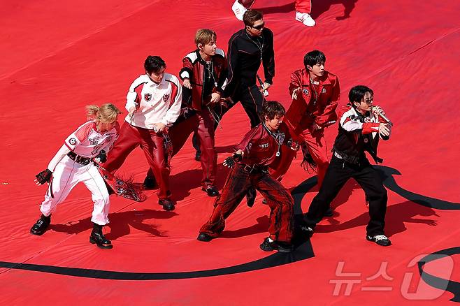 The group BTS appeared at the 2026 FIFA World Cup Final Halftime Show, receiving enthusiastic cheers from audiences around the world. Member Suga left a deep impression by taking the stage wearing an outfit adorned with a Red Devils patch.BTS Bon Voyage graced the stage as a co-headliner alongside Madonna, Shakira, and Justin Bieber at the final held at MetLife Stadium in New Jersey, USA. They heightened the atmosphere by passionately singing their hit song Dynamite, and the entire group, starting with member Jungkook, delivered a high-quality performance.This halftime show was a first in World Cup history, designed to unite the world by combining sports and music. It garnered attention as it was curated by Chris Martin of Coldplay, and BTS Bon Voyage had a meaningful time conveying a message of hope and harmony through music.The members concluded the performance in a peaceful atmosphere, performing the finale together with a childrens choir. Jungkook continued his special connection with the World Cup by taking the stage for the final match, following the opening ceremony of the 2022 Qatar World Cup.