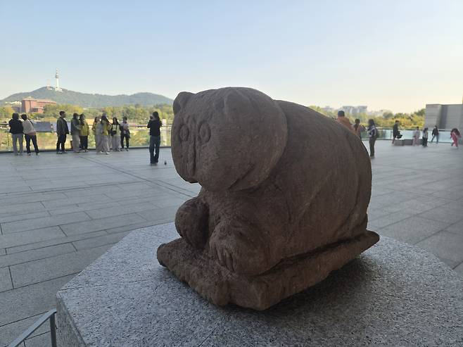 A stone tiger sculpture from the Joseon Dynasty (1392–1910), which previously belonged to You Hong-june's wife, is seen installed on the outdoor steps of the National Museum of Korea in central Seoul. KANG HYE-RAN