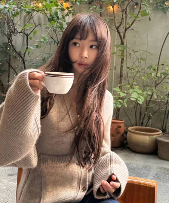 Actress Kang Ye-won has captured attention with her ageless beauty and girlish aura.On the 19th, Kang Ye-won shared updates on her life by posting two photos on her personal social media.In the photos, Kang Ye-won is seen striking a natural pose while holding a cup.She shared a witty glimpse into her daily life by adding the caption, One warm cup, one cold cup. A balanced intake of sugar.In particular, she exuded an innocent yet delicate vibe by pairing a beige cardigan with a natural wavy hairstyle.The combination of her long hair and bangs further highlighted her doll-like visuals.Although she is looking away in both photos, her large, distinct eyes are undeniable and drew attention.Furthermore, her neatly manicured nails, devoid of elaborate nail art, added to her natural charm.Previously, Kang Ye-won garnered attention after confessing on a variety show that she had undergone eye surgery seven times. Meanwhile, Kang Ye-won has been active in various works, including the films Haeundae and Harmony, and is currently awaiting the release of a new movie.Photo = Kang Ye-wons SNS