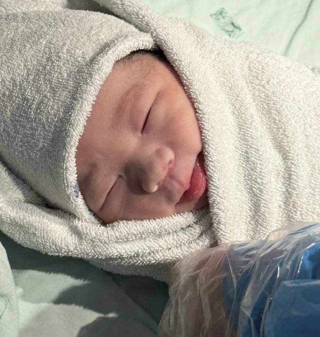 Actor Kang Seok-woo was deeply moved as he held his first grandchild in his arms.On the 28th, Kang Seok-woo posted several photos and a message on his social media, saying, Ah! My son gave birth to my son. I vividly remember 5 a.m. on November 23, 1991, when I met my son at that hospital... Time has passed, and a big gift has arrived.The photos revealed a birth card for his grandchild, along with images of the small and adorable baby, exuding loveliness. A photo of his son and his wife was also included, drawing attention with their handsome and beautiful visuals.Kang Seok-woo also shared a photo he created to predict his grandchilds face, commenting, It seems to resemble the face I predicted. Actress Lee Min-jung offered her congratulations, saying, Wow. Congratulations so much.Meanwhile, Kang Seok-woo has one son and one daughter, and his son held his wedding last year. Kang Seok-woo previously appeared with his son on the SBS variety show Please Take Care of My Dad in 2015. Kang Seok-woos son is a graduate of Yonsei Universitys Department of Business Administration and has garnered attention for resembling CNBLUEs Jung Yong-hwa.