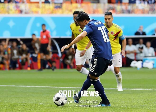 ▲ SARANSK, RUSSIA - JUNE 19: Shinji Kagawa of Japan scores his team's first goal from the penalty spot during the 2018 FIFA World Cup Russia group H match between Colombia and Japan at Mordovia Arena on June 19, 2018 in Saransk, Russia. (Photo by Elsa/Getty Images)