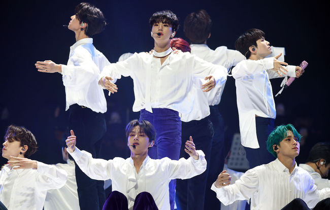 Members including boy group Seventeen Hoshi (middle) perform at the 30th High1 Seoul Song Awards held at the Olympic Park Gymnastics Stadium in Songpa District, Seoul on the 31st.Photos