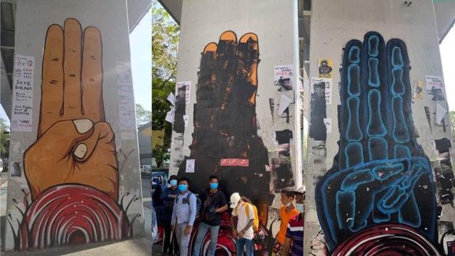 20일 미얀마 양곤 고가도로 하단부에 그려진 '세 손가락 경례' 그림을 경찰이 검은 페인트로 지우자 미술가들이 그 위에 다시 그림을 그렸다. SNS 캡처