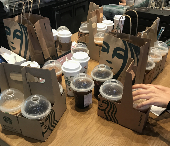 A cluster of Starbucks' 50th anniversary reusable cups are placed on a pick-up counter at the coffee franchise's store in Sangam-dong, Mapo District, western Seoul. [LEE TAE-HEE]