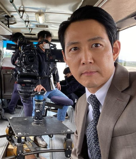 Actor Lee Jung-jae has reported on the recent scene of the directors debut Hunt shooting.Lee Jung-jae posted a picture on his instagram on the 16th.Lee Jung-jae in the photo stares at the camera in a neat suit, especially with a distinctive features and intense eyes, and boasts a unique director force.Lee Jung-jae is enjoying global popularity through Netflix squid game.He is currently in the midst of shooting Hunt, which he directs and looks at.no