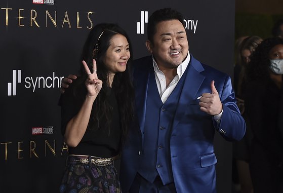 Director Chloe Zhao, left, and Don Lee arrive at the premiere of ″Eternals″ on Monday, Oct. 18. 2021, in Los Angeles. (Photo by Jordan Strauss/Invision/AP)