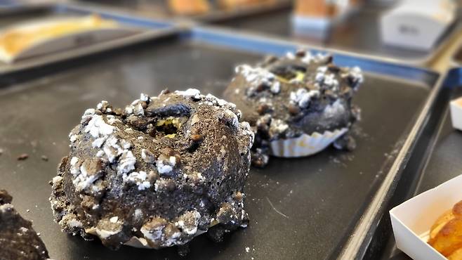 The squid-ink cream cheese donut is one of the signature items at P.Ark Cafe and Bakery. (Kim Hae-yeon/The Korea Herald)