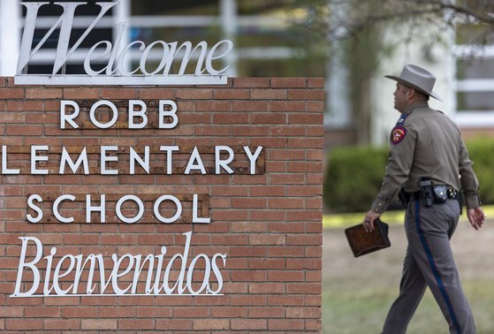 텍사스 주 경찰이 롭초등학교의 정문을 통해 학교 안으로 들어가고 있다. 연합뉴스