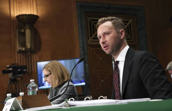 Andrew Adams (R), Director, Task Force KleptoCapture at the US Department of Justice, and Elizabeth Rosenberg, Assistant Secretary For Terrorist Financing And Financial Crimes at the US Department of Treasury, testify before the Senate Banking, Housing, and Urban Affairs Committee on Russian sanctions, on Capitol Hill, September 20, 2022 in Washington, DC. The Committee held the hearing to discuss additional sanctions against Russia for its invasion of Ukraine. (Kevin Dietsch/ AFP via Getty Images)