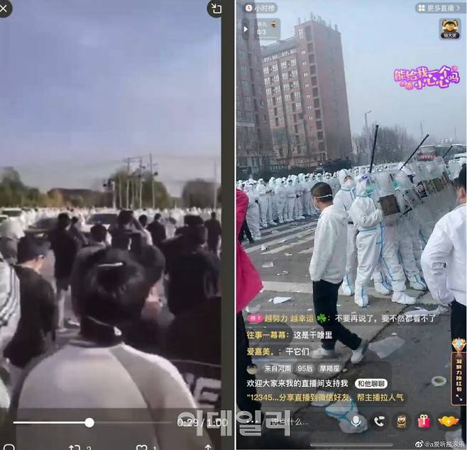 중국 정저우 폭스콘 공장에서 노동자들과 방역옷을 입은 이들이 충돌하고 있다. 사진=웨이보
